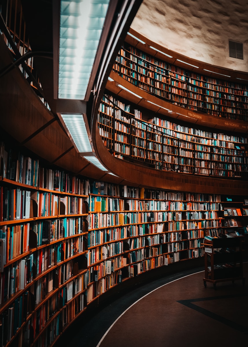 photo of brown wooden bookshelf